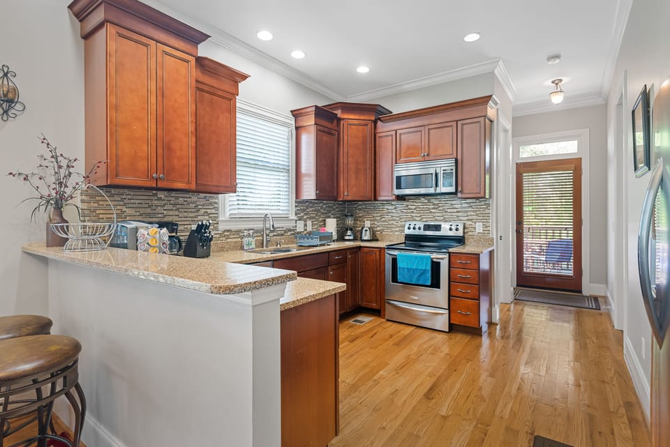 Full kitchen, equipped w/ coffee maker, blender, pots and pans, utensils, etc.