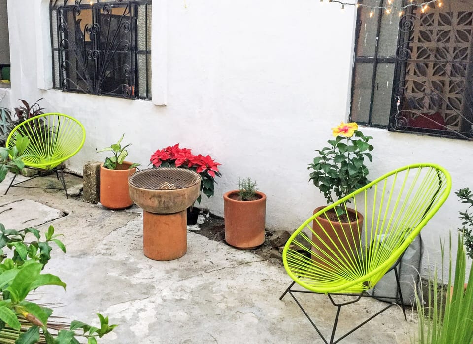 Outdoor patio. Charcoal grill.