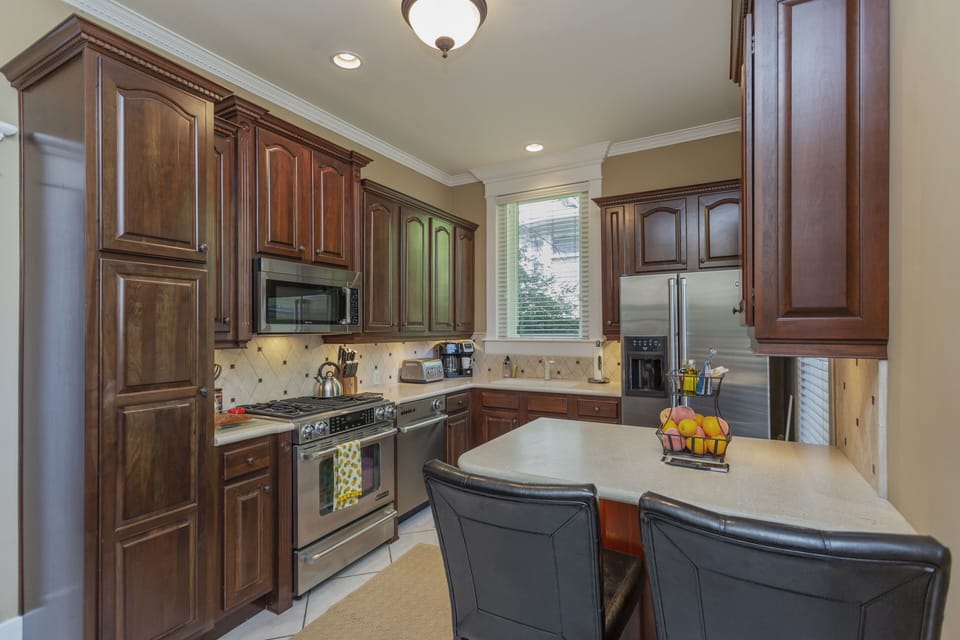 Fully stocked kitchen with Jenn-Air stainless steel appliances.