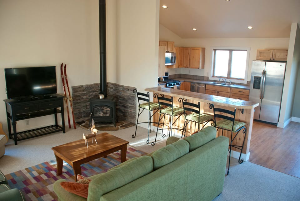 Great room opens to a full kitchen with plenty of space to entertain and relax. 