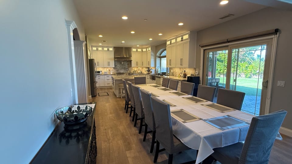 Dining for 12 + 6 nearby seats. Open floor plan from LR thru DR to kitchen. 