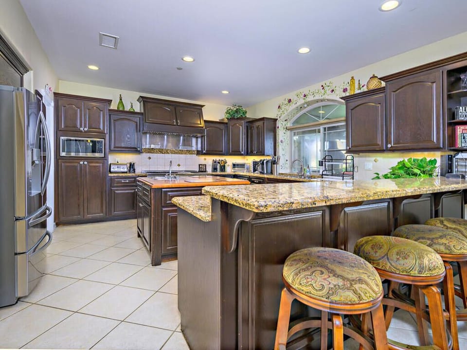 Chef's Open-Kitchen overlooking Backyard and views.