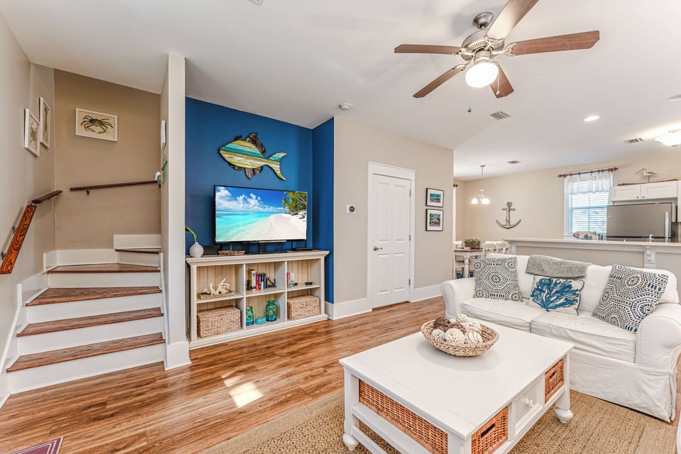Cozy furniture, flat screen TV, open concept = a great getaway vibe!