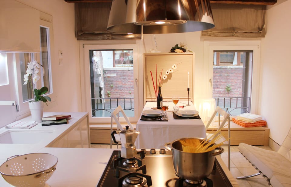 A comfortable and functional kitchen/living room, with a wonderful view