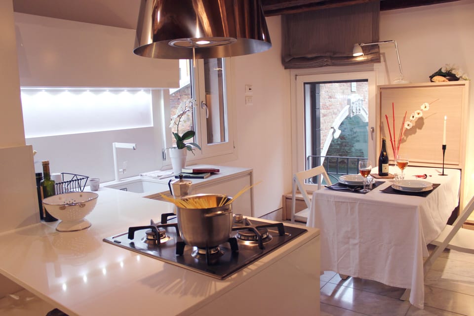 A comfortable and functional kitchen/living room, with a wonderful view