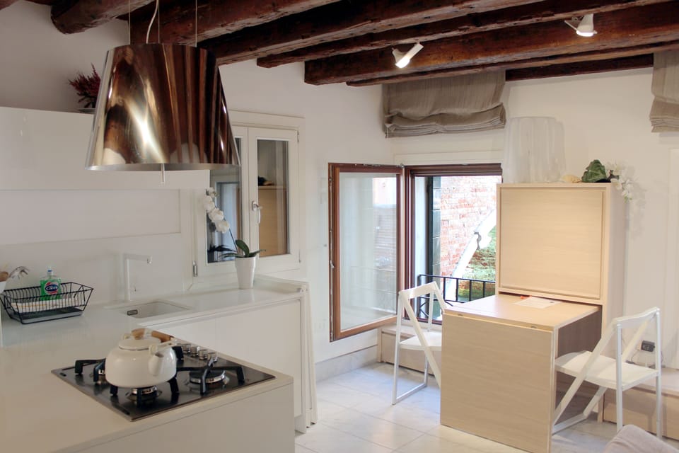 A comfortable and functional kitchen/living room, with a wonderful view