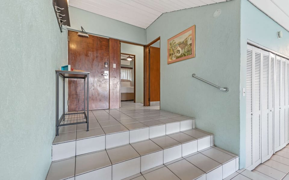 Front Door and steps to the living area