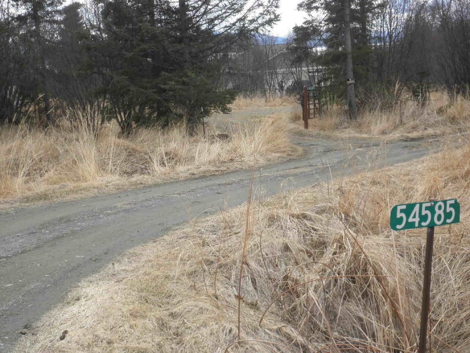 Turn right on Rolling Meadows and the house is the first left through the gate