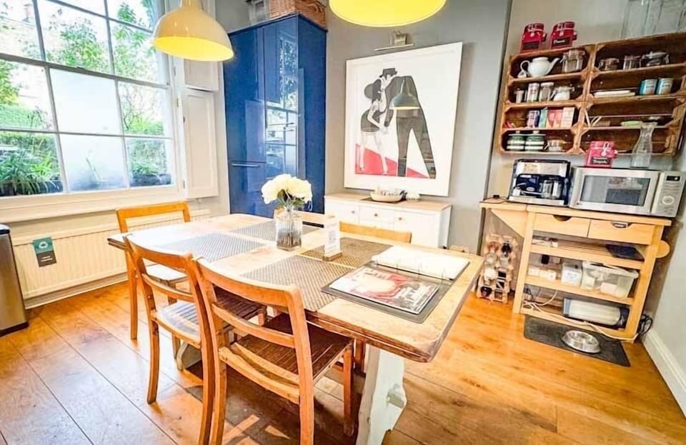 Dining table seats 6 in fully stocked kitchen of a family