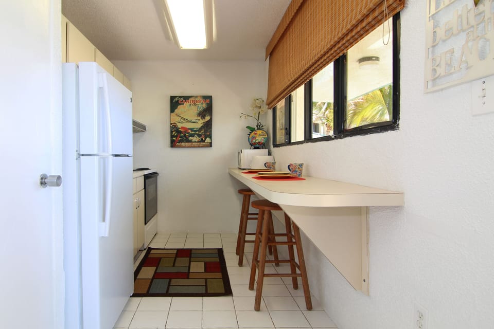 Full Kitchen with ocean view for enjoying your own meals.  Closest to pool.
