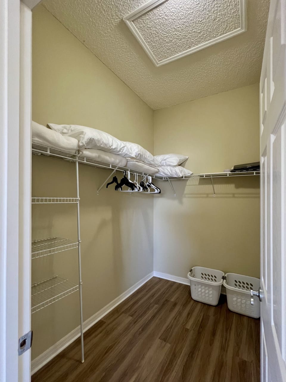 Large Walk In Master Closet with Extra Pillows and Blankets