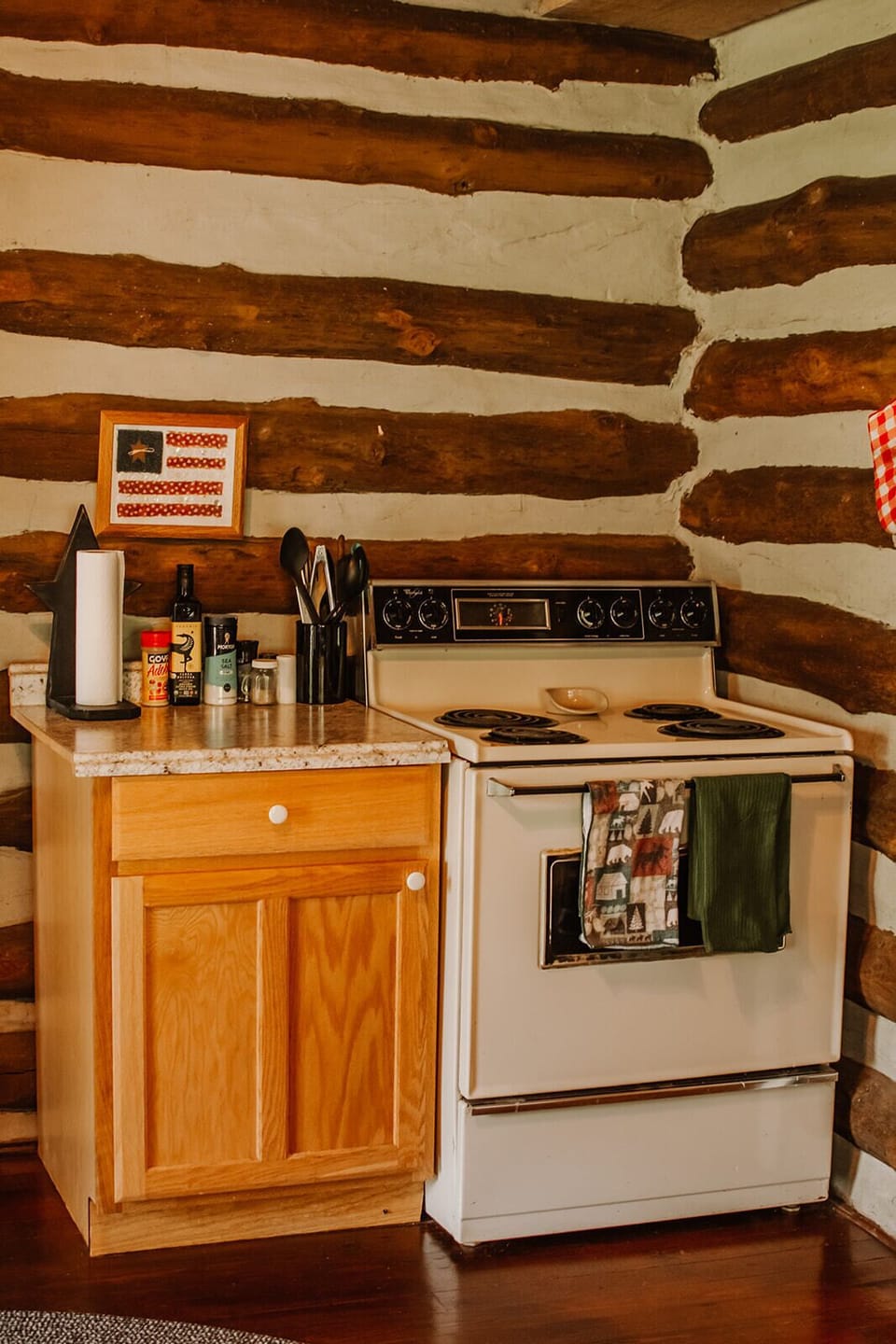 Full size stove and oven with plenty of cookware and utensils 