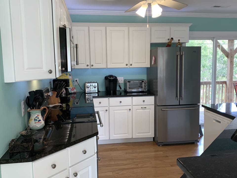 Kitchen with Granite Countertops and Stainless appliances