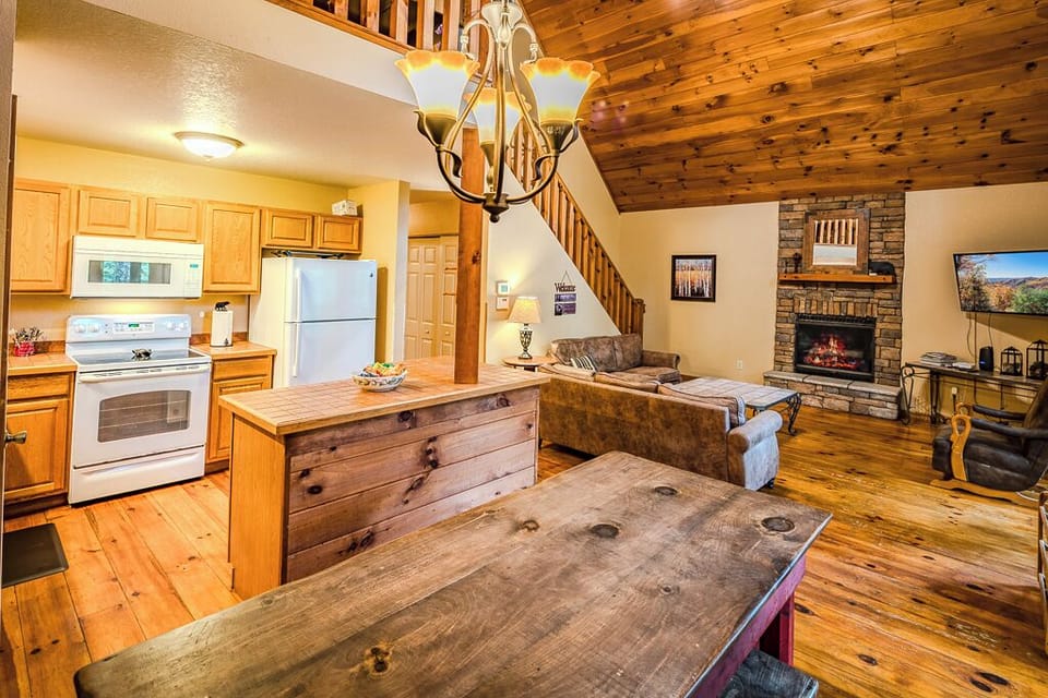 The dining, kitchen, and living rooms are open which is perfect for hosting meal