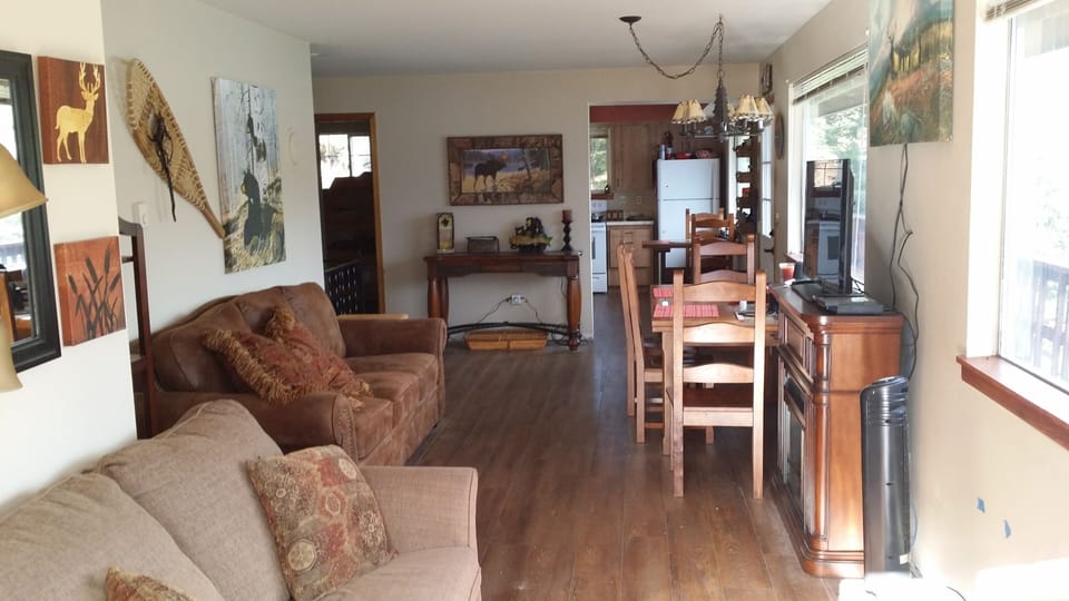 A view of the living room which opens onto two decks.