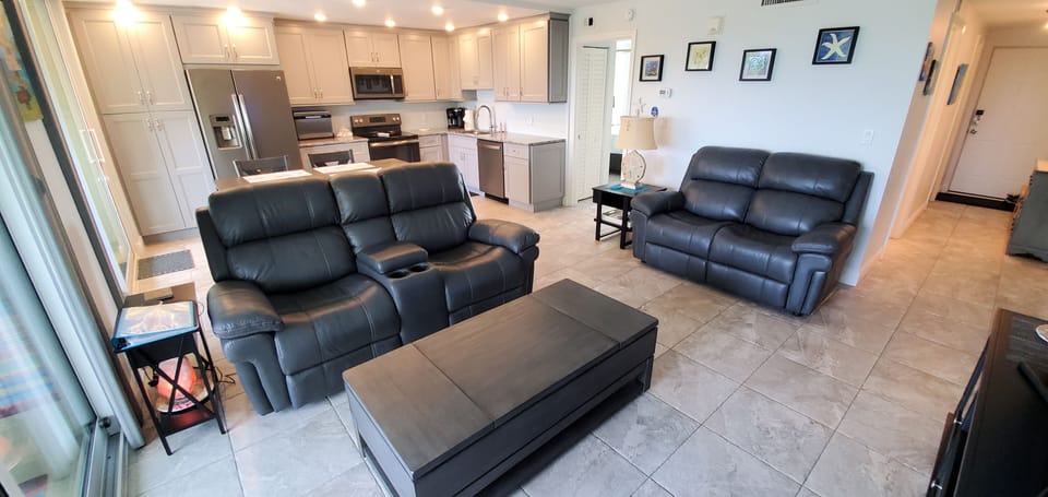 Open concept comfortable living and kitchen area 