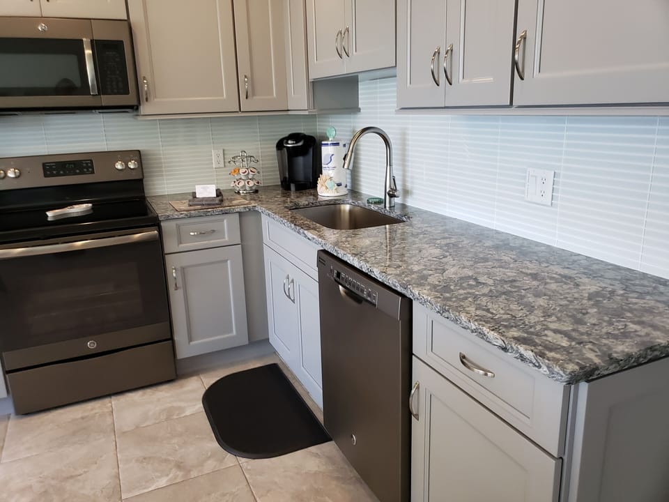 Quartz counter tops and tile floors throughout 