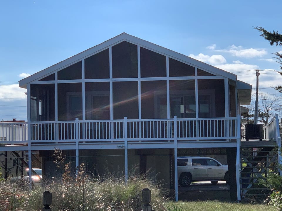 Screened porch overlooking the bay