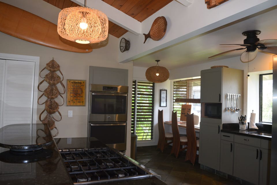 Granite countertops, breakfast bar and a bay window.