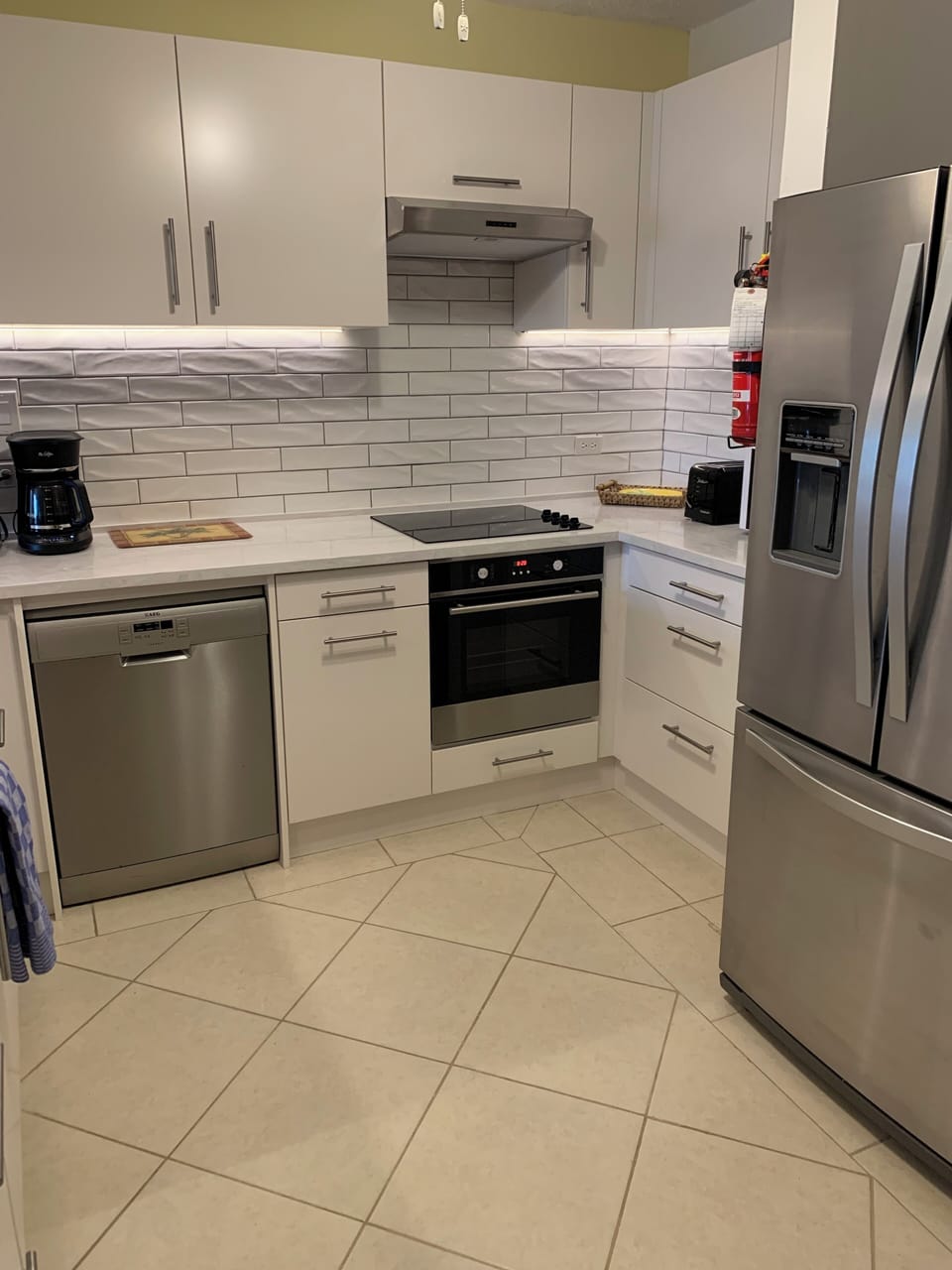 New kitchen including French door refrigerator with automatic ice maker.