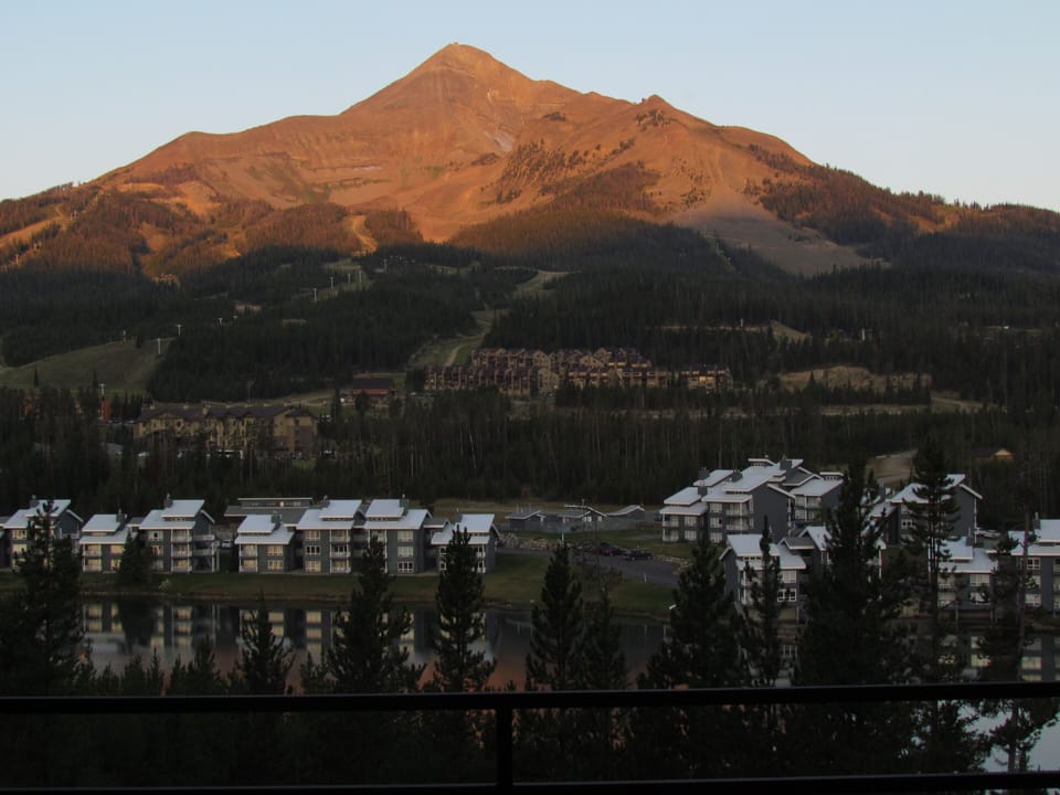 Sunrise over Lone Peak and Lake Lewinsky from the deck; Summer.