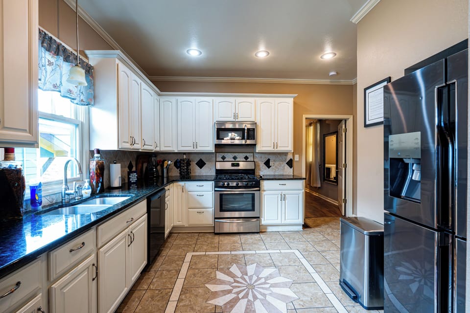 Kitchen equipped with all stainlees steel apliances.