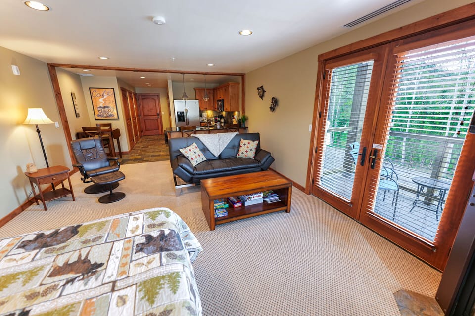 Interior of condo. Balcony doors on right.