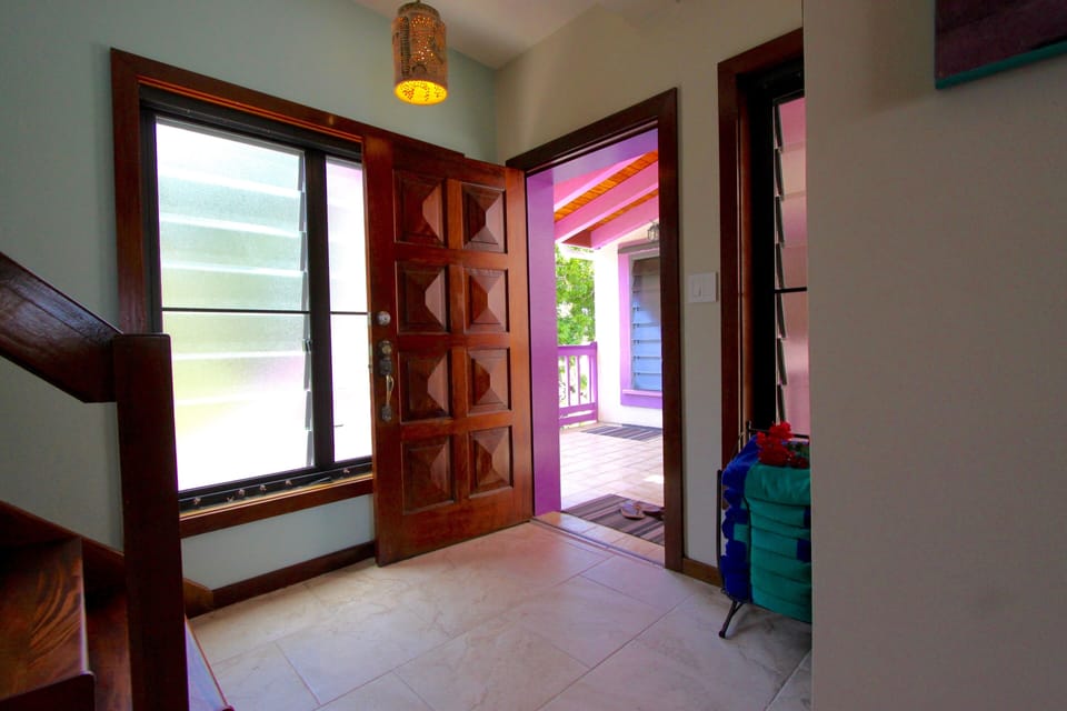 The entryway as well as the rest of the condo is trimmed in rich Mahogany