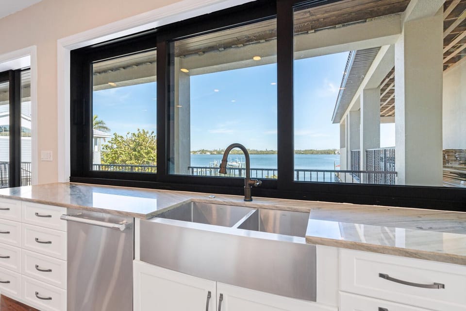 Looking outside while doing the dishes. These windows slide open. 