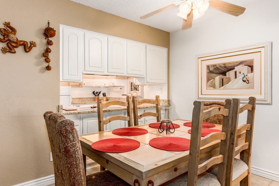 Fancy kitchen cabinets open from both rooms!  Need a glass in a hurry?