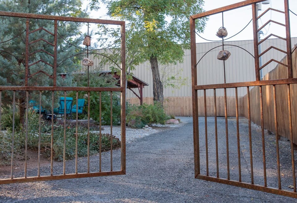 Gates to the back yard and parking area.
