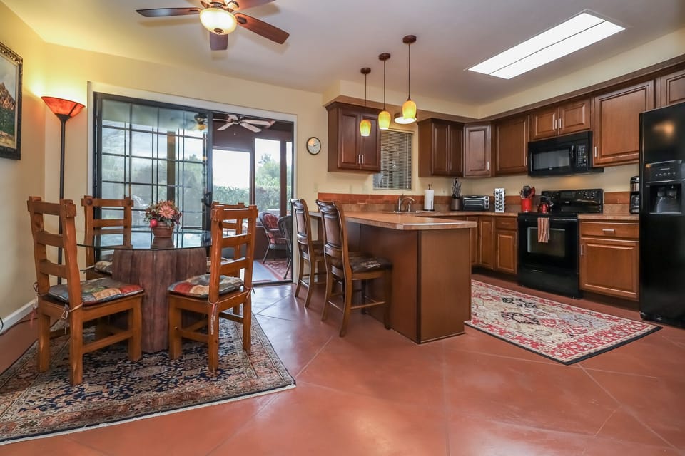 Open dining room and kitchen.  That is a sky light in the kitchen.