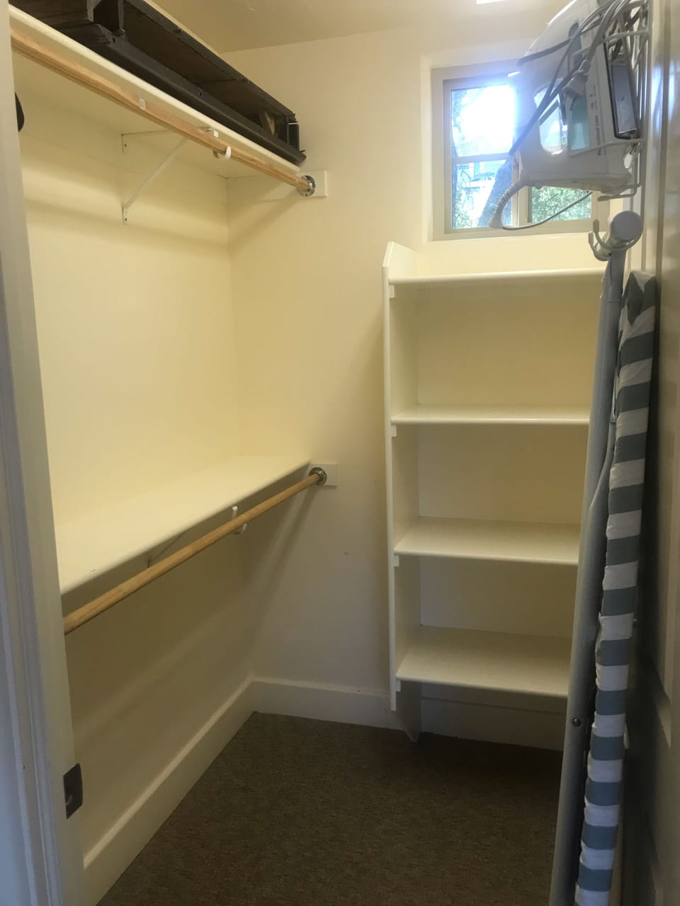 Master closet with lots of room. Iron & ironing board 