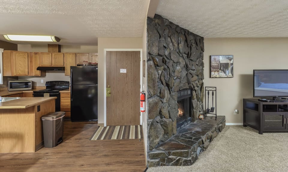 Fireplace Living Area open to Kitchen and Dining Area