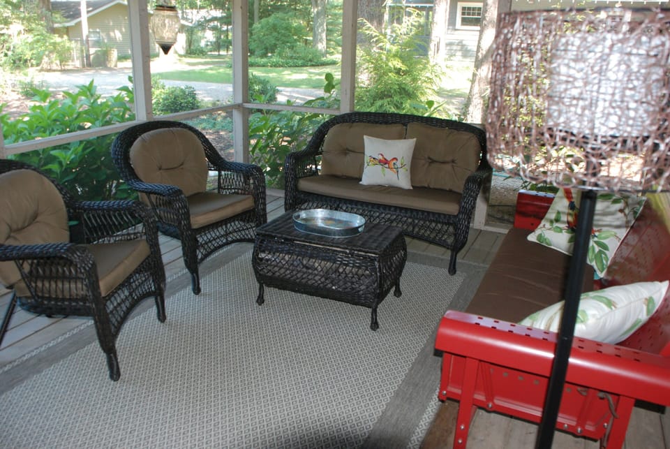 Screen porch with fan & reading light,  table & chairs, hooks to dry wet items