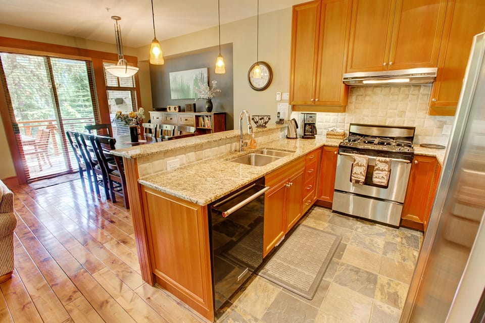 Gourmet kitchen with granite countertops and stainless steel appliances