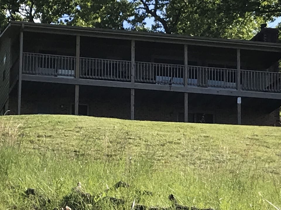 House upper deck and lower patio view from the lakefront.