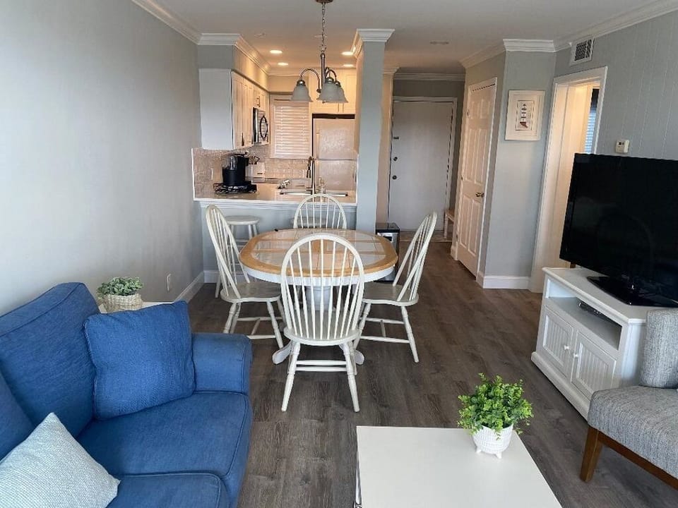 Living room with large screen tv with cable