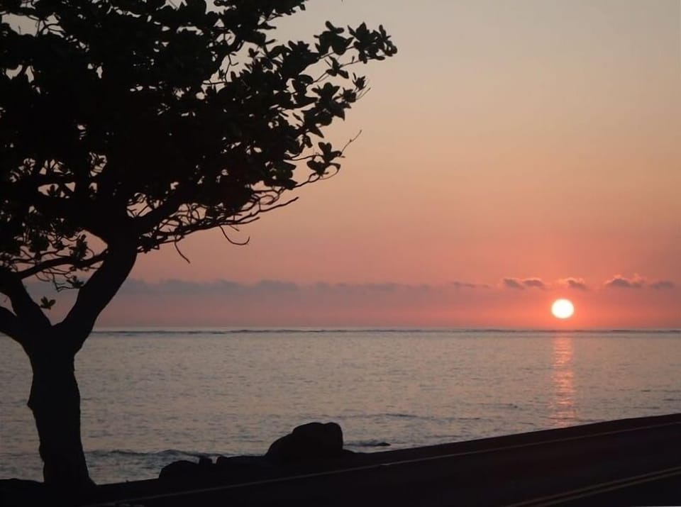 Sunrise over ocean.  Look for the occasional green flash.