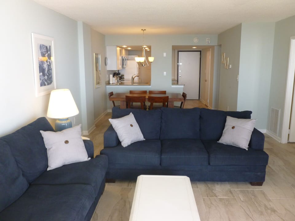 Living room with new porcelain tile floors.