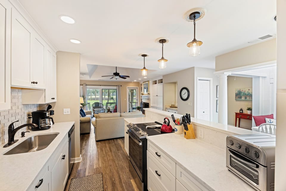 Prepare a spectacular meal in the fully equipped and updated kitchen with views of the golf course.
