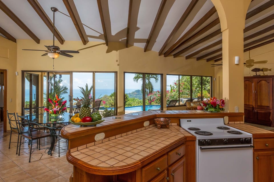 View from kitchen to pool patio and ocean