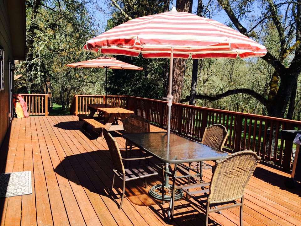 Enjoy family meals on the large 40 ft deck overlooking the river - 2 BBQ Grills!