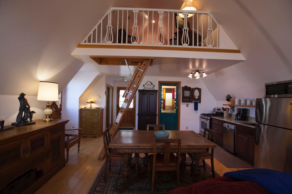 Dining Room w/Steps to Loft Bedroom