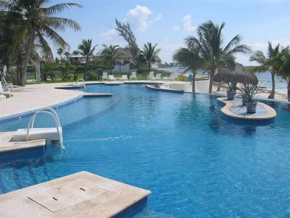 Sit by the pool under an umbrella or on the beach under a palapa. So relaxing!