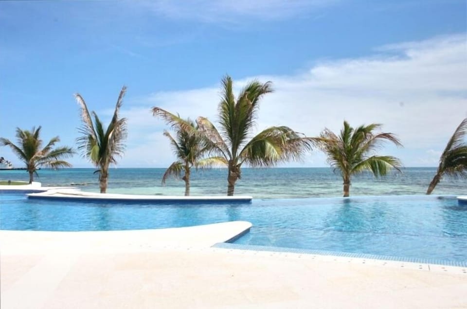 Infinity pool with Caribbean  in the background. Don't be the last one in.