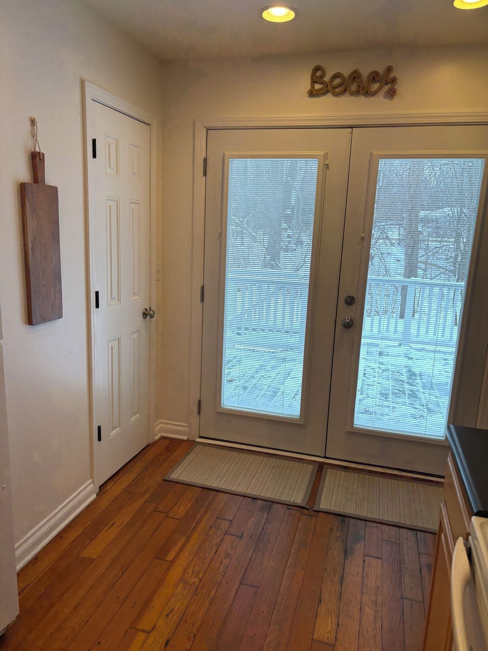Kitchen French Doors Open to Back Deck and Yard