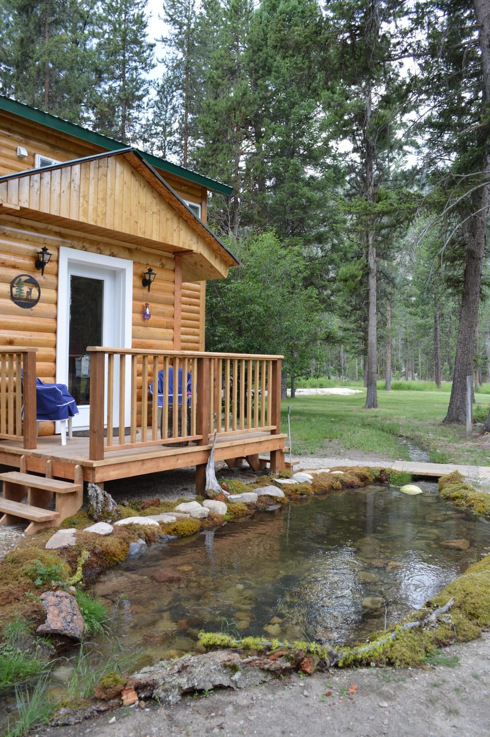Front door with porch and creek 