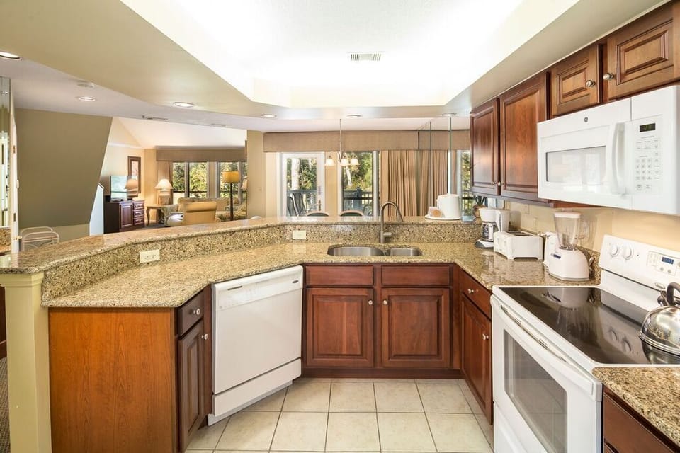 Fully equipped Kitchen with access to a large size washer and dryer. 