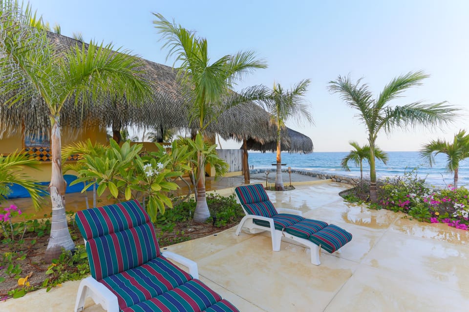 35ft palapa with outdoor kitchen and table for 6 underneath.
